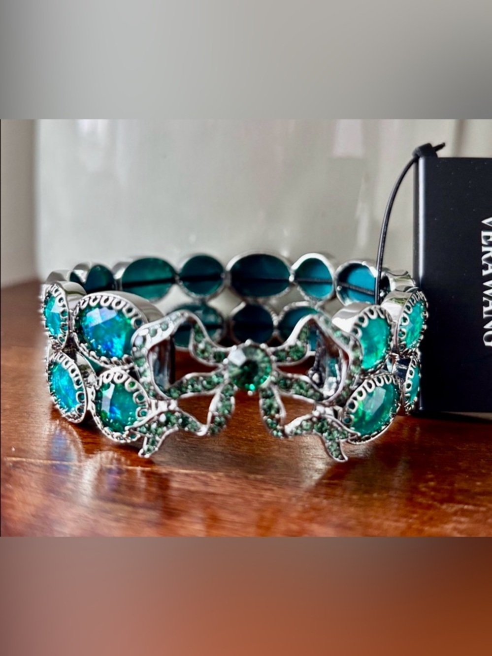 Vera Wang Silvertone Stretch,beveled iridescent acrylic stones, bow,greens/aqua